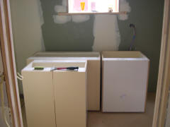 The new laundry going in where the old kitchen bench was